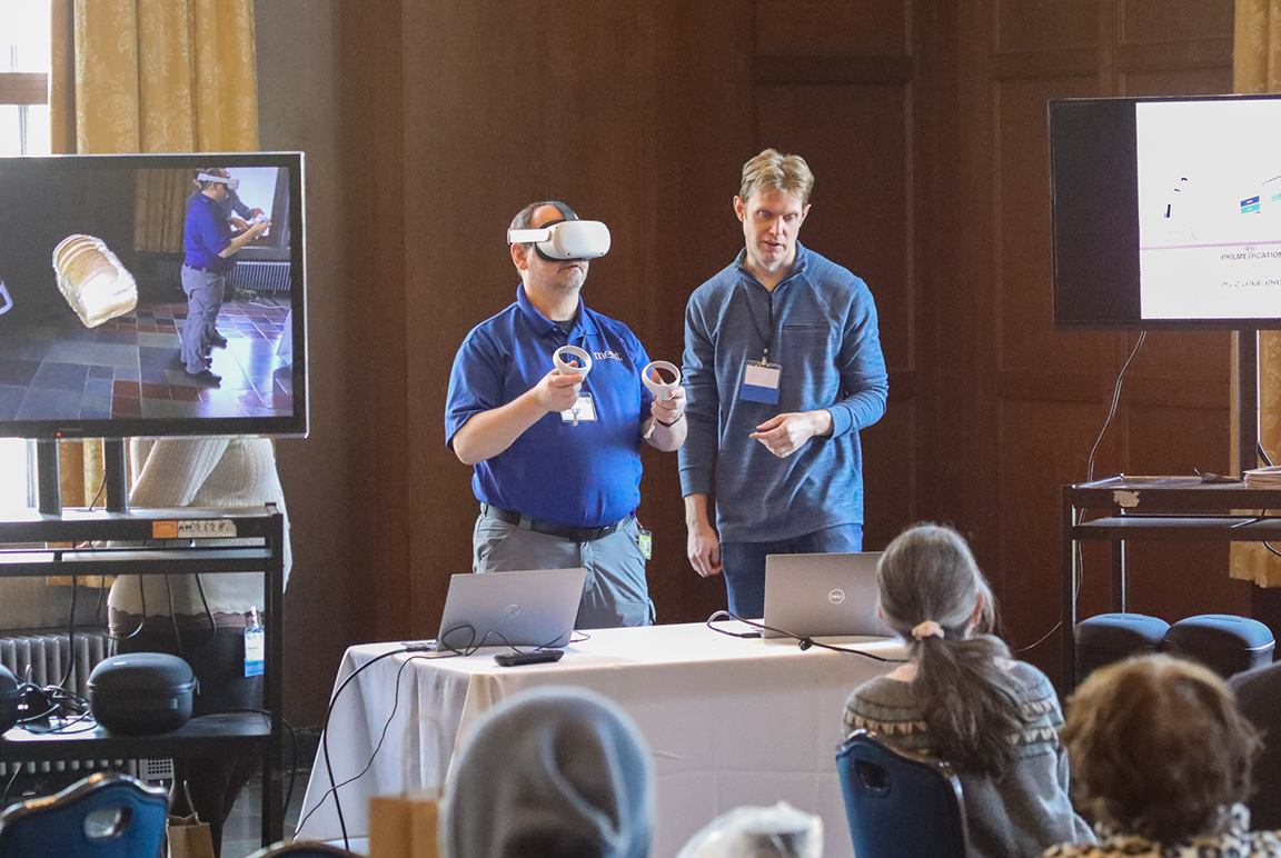 Person tries on a pair of Augmented Reality goggles to experience the technology during a demonstration session. Photograph by Joel Iverson, ITS Marketing and Communications